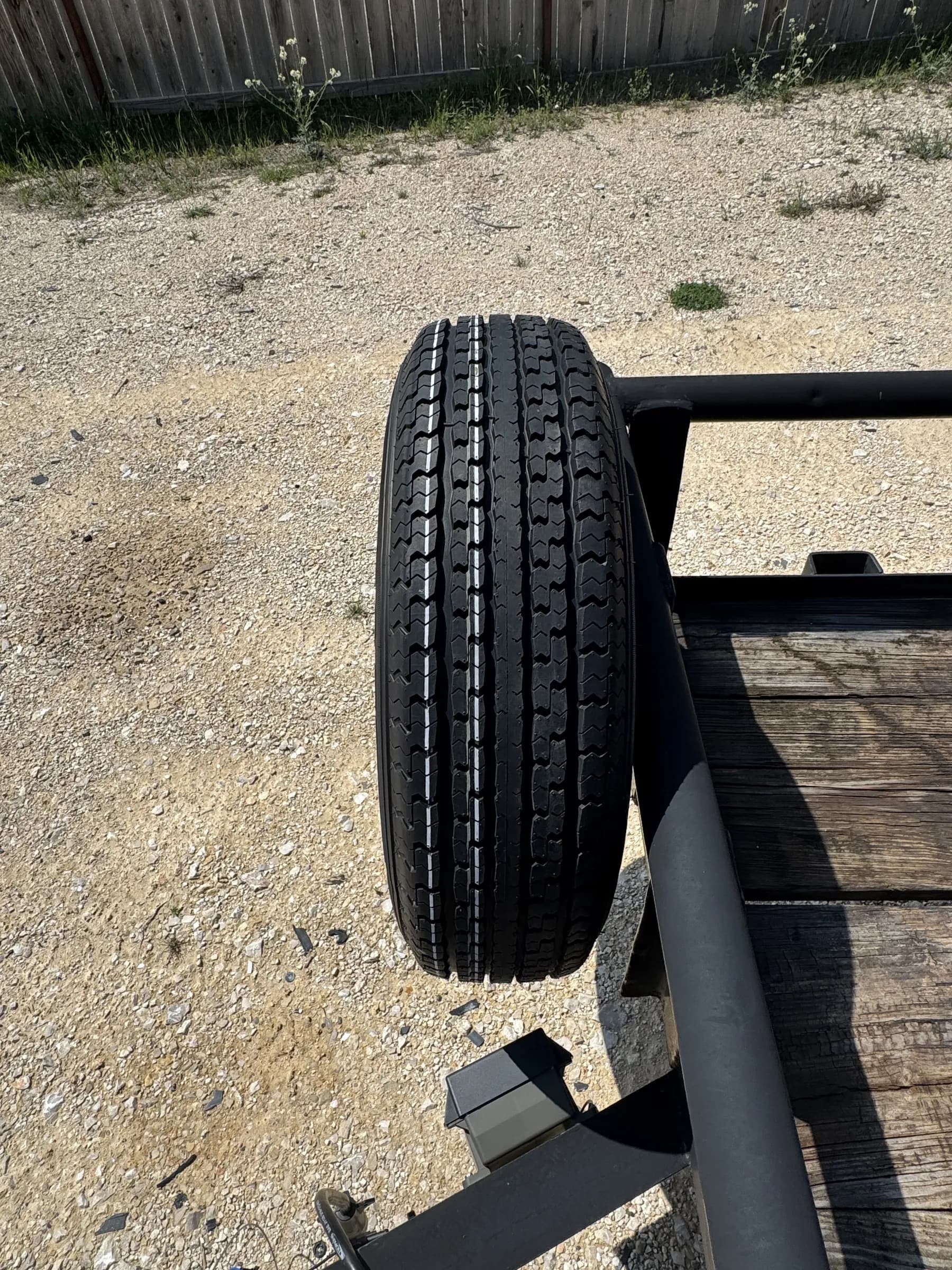 Spare tire detail mounted on the RedLine 16-foot utility trailer