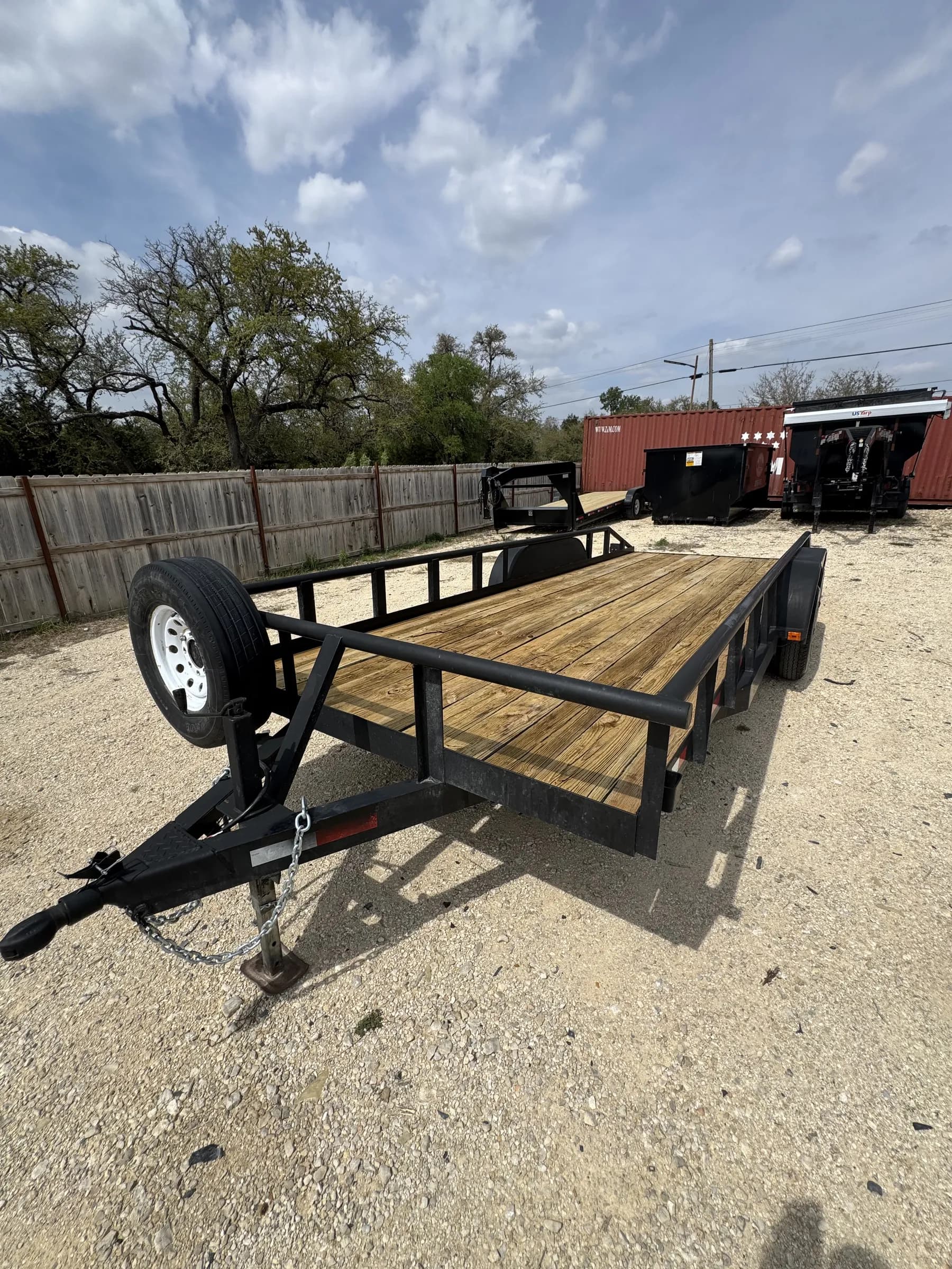 20-foot flatbed utility trailer with wood deck on the RedLine rental yard