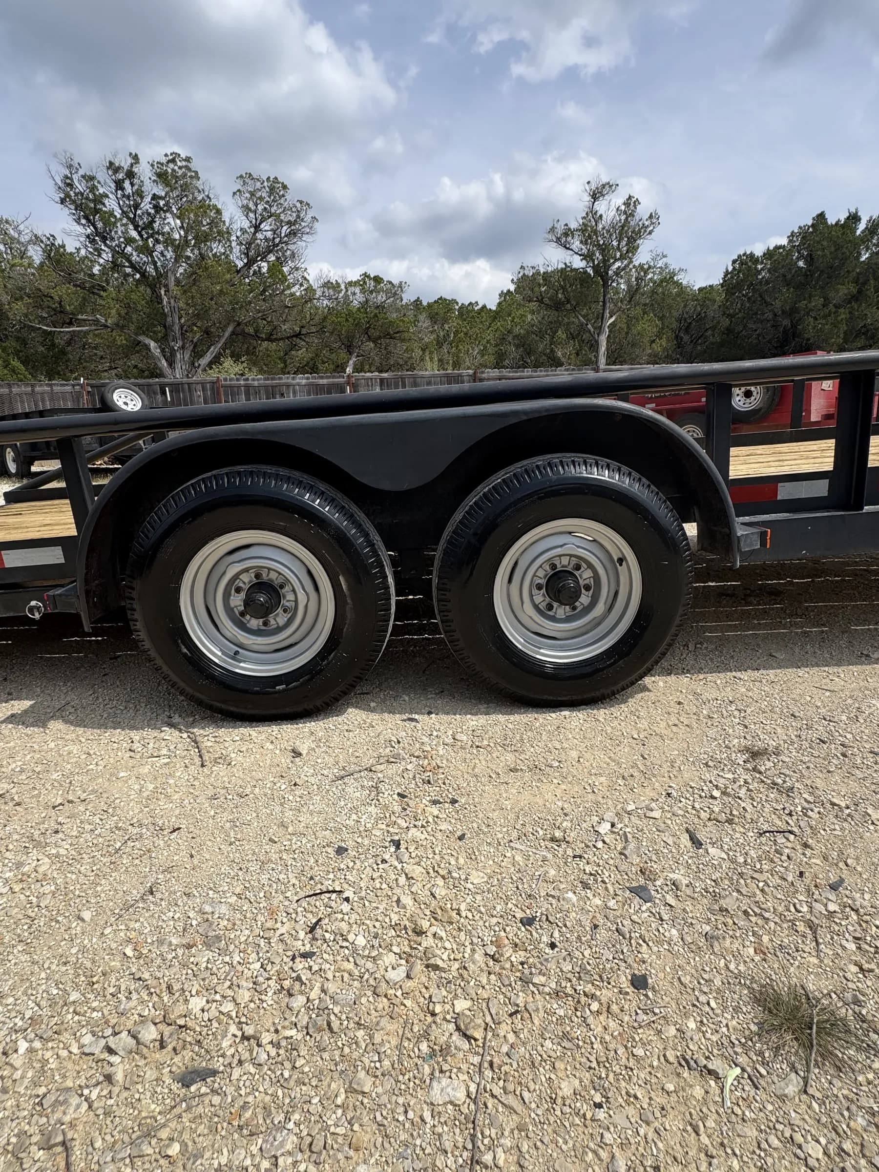 Dual wheels and axle close-up on the RedLine 20-foot trailer