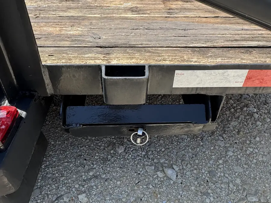 Rear hitch and weathered wood deck close-up on the RedLine 16-foot trailer
