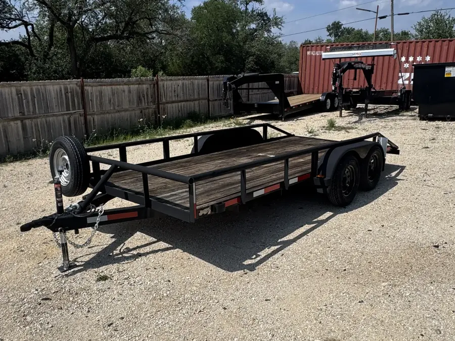 16-foot utility trailer with wood deck and side rails on the RedLine rental lot