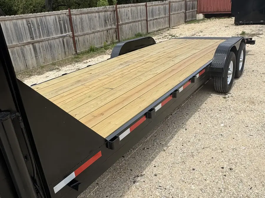24-foot gooseneck flatbed trailer with wood deck at the RedLine rental yard